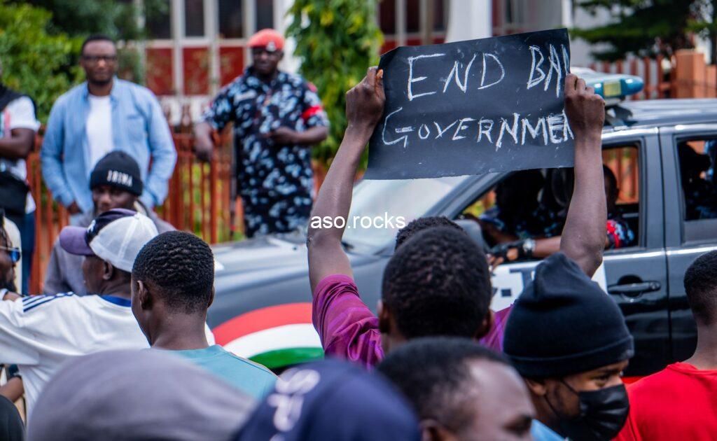 Nigerian demonstrators hold an End Bad Government sign at a political protest rally